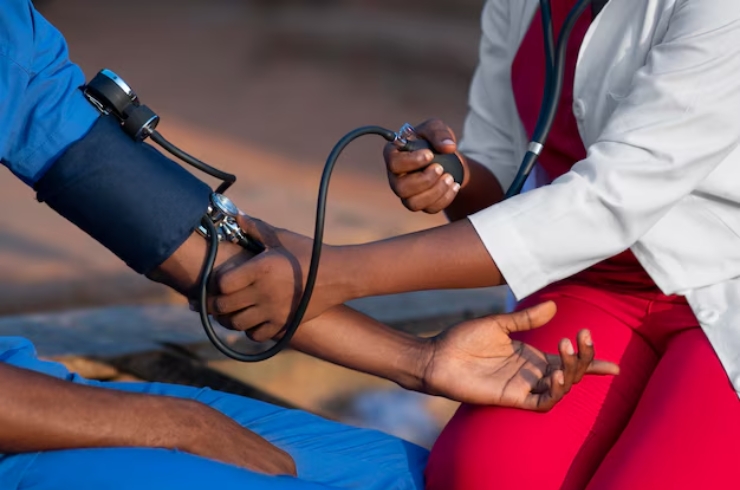 Pharmacist conducting a blood sugar test